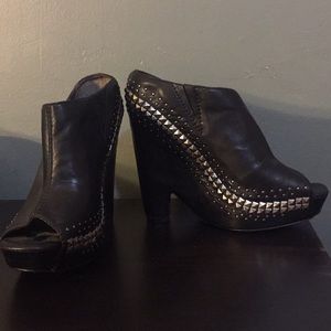 Sam Edelman heeled slides boots.
